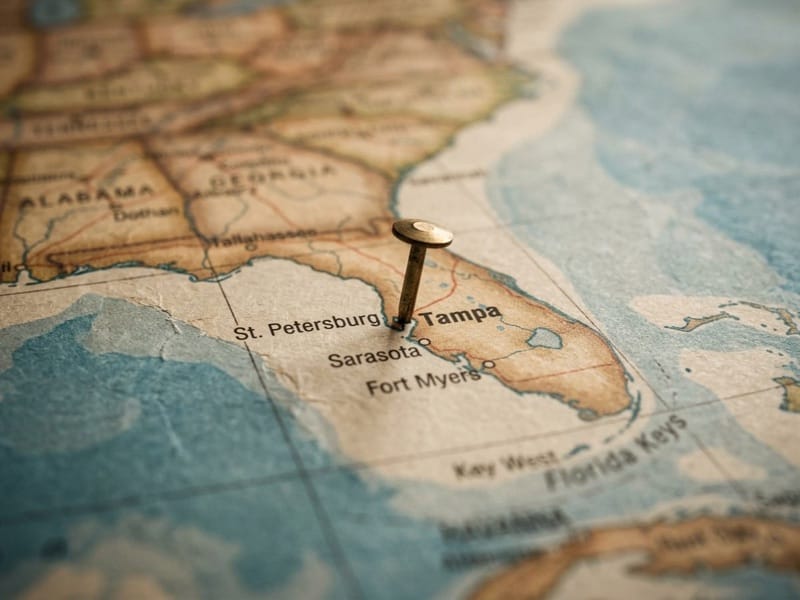 Push pin marking Tampa on a vintage-style map of Florida