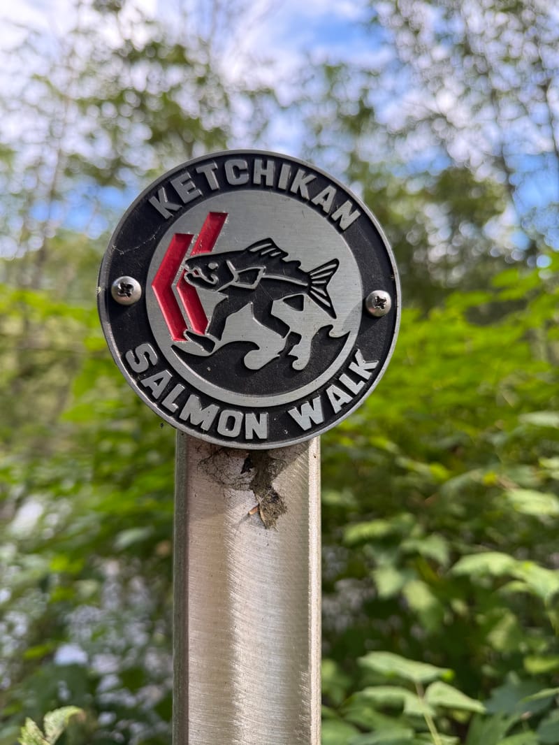 A Ketchikan Salmon Walk sign on a post